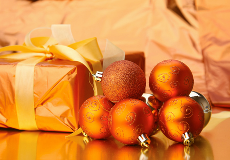 Gift boxes with balls on a christmas background.の写真素材