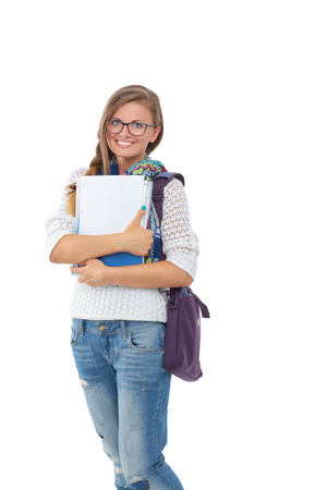 Portrait of young student woman holding exercise books.の写真素材