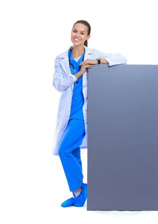 A female doctor with a blank billboard.の写真素材