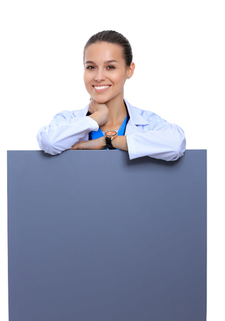 A female doctor with a blank billboard.の写真素材