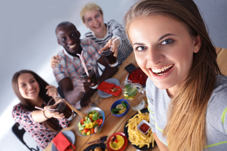 Group of people doing selfie during lunch.の写真素材
