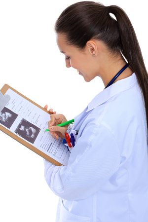 Female doctor with clipboard,isolated on white background.の写真素材