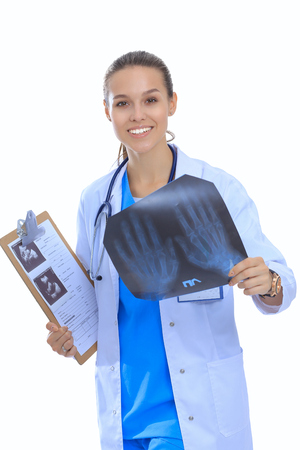 Female doctor examining x-ray, isolated on white background.の写真素材