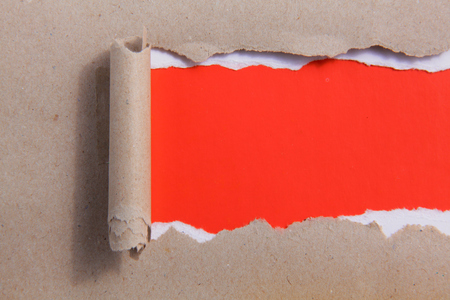 rip red paper and white background .の写真素材