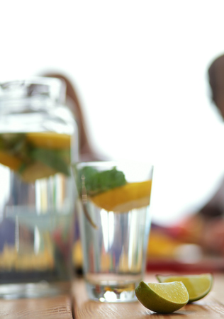 Glass with drink lime on desk.の写真素材