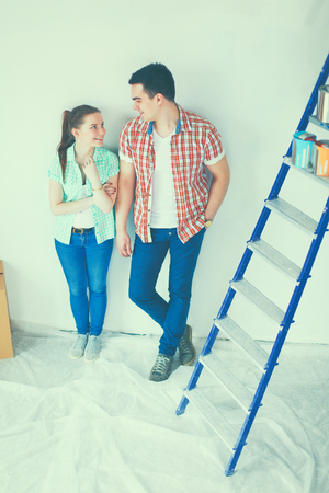 Portrait of young couple moving in new home.の写真素材
