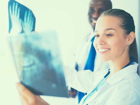 Female doctor looking at the x ray picture.の写真素材