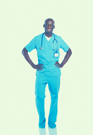Portrait of a doctor man standing isolated on white background.の写真素材