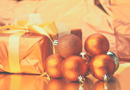 Gift boxes with balls on a christmas background.の写真素材