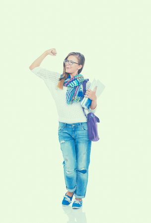 Portrait of young student woman holding exercise books.の写真素材