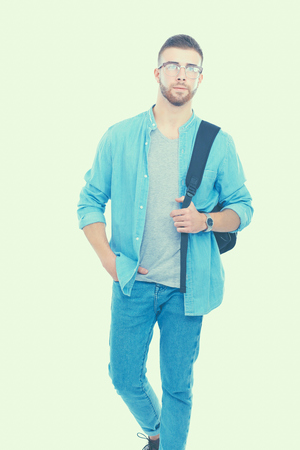 A male student with a school bag holding books isolated on white backgroundの写真素材