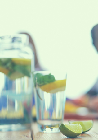 Glass with drink lime on desk.の写真素材