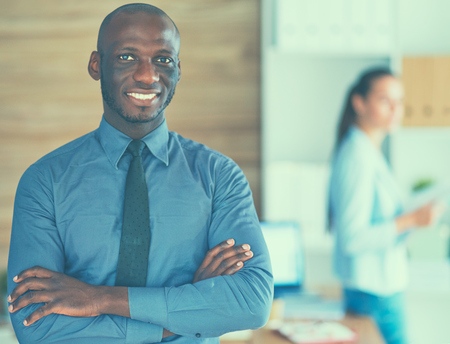 African-American Businessman over business office background.の写真素材