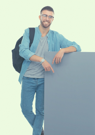 Portrait of a smiling male student holding blank board.の写真素材