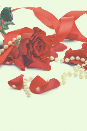 Red rose petals isolated on white background.の写真素材