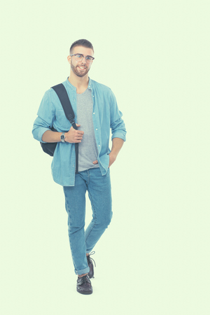 Young man standing with handbag,isolated on white background.の写真素材