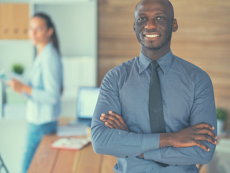 African-American Businessman over business office background.の写真素材