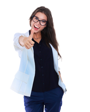 Portrait of a beautiful young woman showing ok, isolated on white backgroundの写真素材