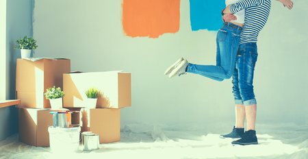 Happy young couple moving in new houseの写真素材