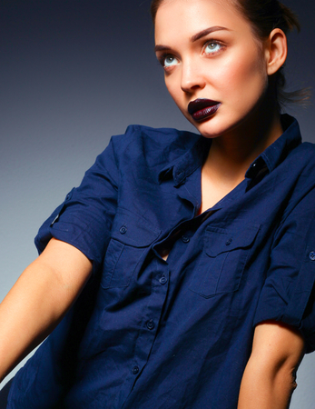 Portrait of beautiful young woman face. Isolated on black backgroundの写真素材