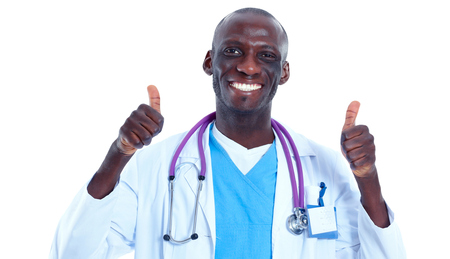 Portrait of doctor showing you ok sign standing in a white uniform on isolated backgroundの写真素材