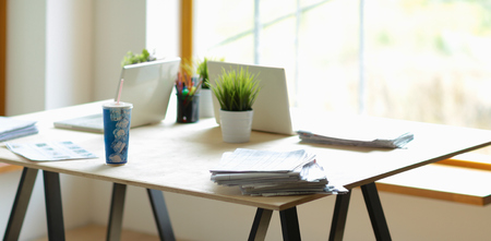 Office desk with laptop and business background.の写真素材