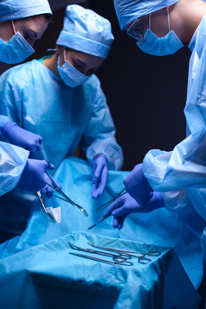 Team surgeon at work in operating room.の写真素材