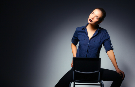 Portrait of beautiful young woman face. Isolated on black backgroundの写真素材