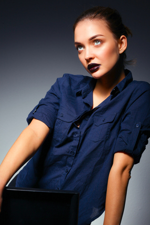 Portrait of beautiful young woman face. Isolated on black backgroundの写真素材