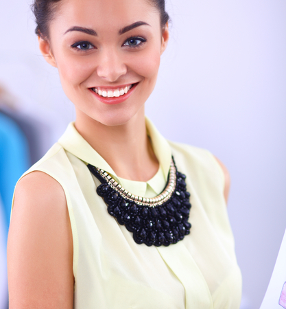 Modern young fashion designer working at studio.の写真素材