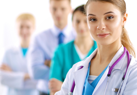 Woman doctor standing with stethoscope at hospitalの写真素材