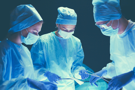 Team surgeon at work in operating roomの写真素材