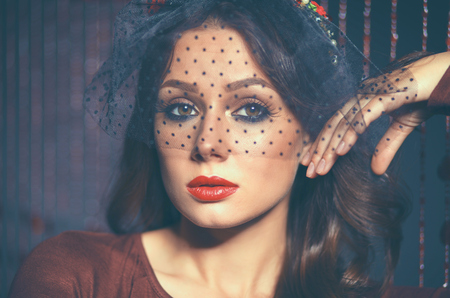 Portrait of a beautiful woman with flowers in her hairの写真素材