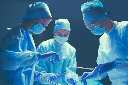 Team surgeon at work in operating roomの写真素材