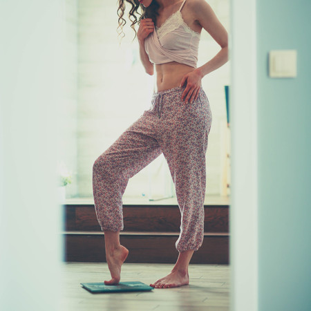 Young woman standing on bathroomの写真素材