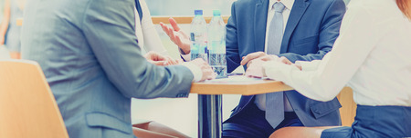 Group of happy young business people in a meeting at officeの写真素材