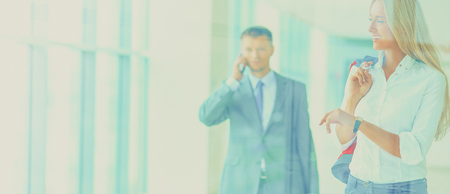 Smiling successful business team standing in officeの写真素材