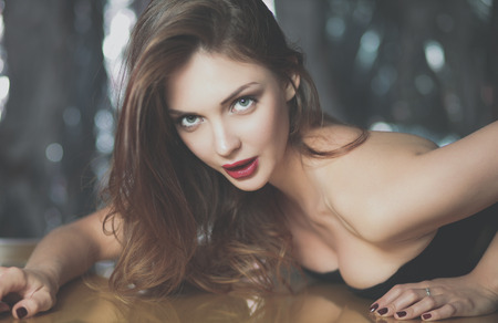Portrait of beautiful girl with trendy makeup lyingの写真素材