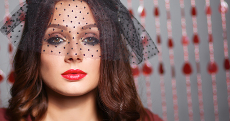 Portrait of a beautiful woman with flowers in her hairの写真素材