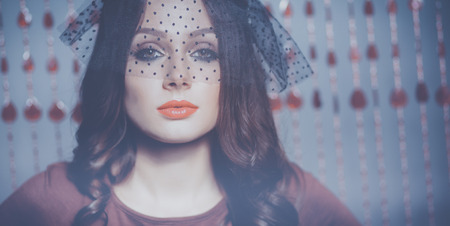 Portrait of a beautiful woman with flowers in her hairの写真素材