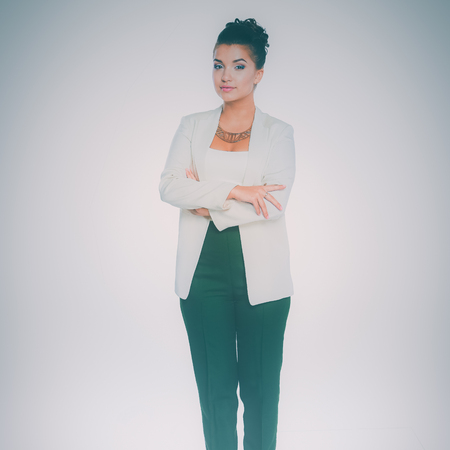 Young woman standing, isolated on white backgroundの写真素材