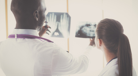 Doctors analyzing an x-ray in a mettingの写真素材