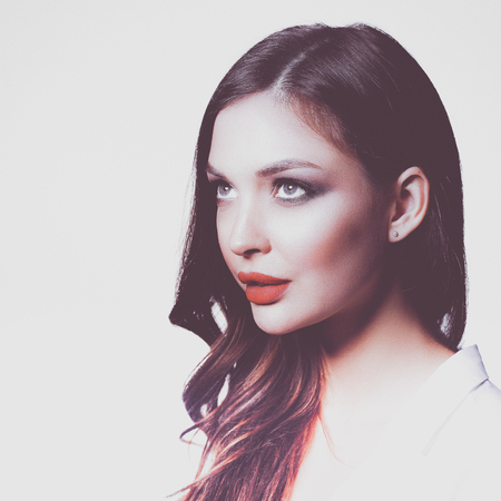 Portrait of beautiful young woman face. Isolated on white backgroundの写真素材