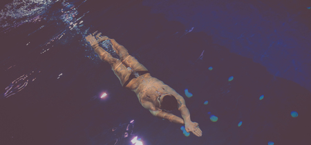 Male swimmer at the swimming pool. Underwater photoの写真素材