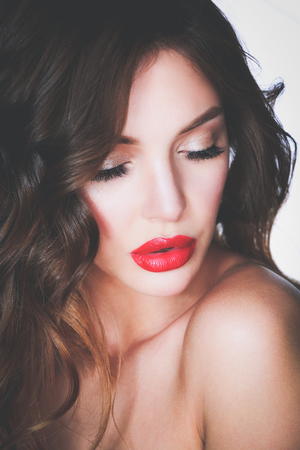 Beautiful woman skin with red lips on white backgroundの写真素材