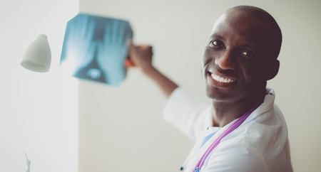 picture of male doctor looking at x-rayの写真素材
