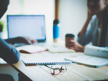 Business woman sitting in her office using a tablet computer. Business woman. Meetingの写真素材