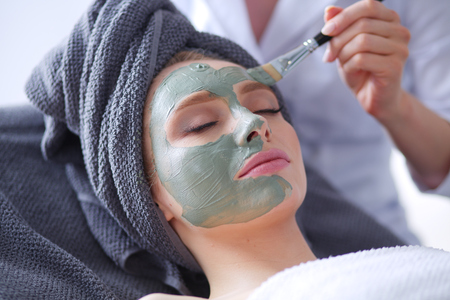 Beautiful woman having mask , lying on spa . Woman. Spa salonの写真素材
