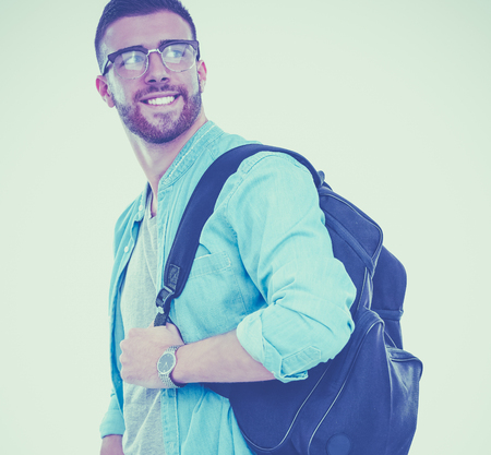 A male student with a school bag holding books isolated on white backgroundの写真素材