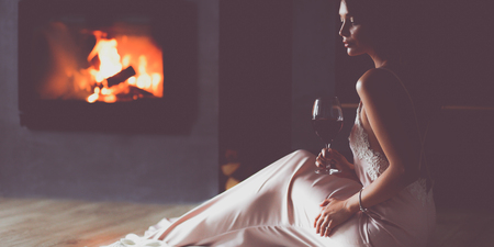 Sexy girl in front of the fireplaceの写真素材